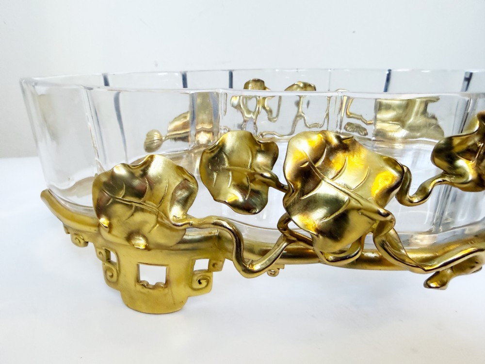 An oval crystal bowl set in an Art Nouveau gilt bronze frame adorned with sculpted leaves and organic vines. View VI