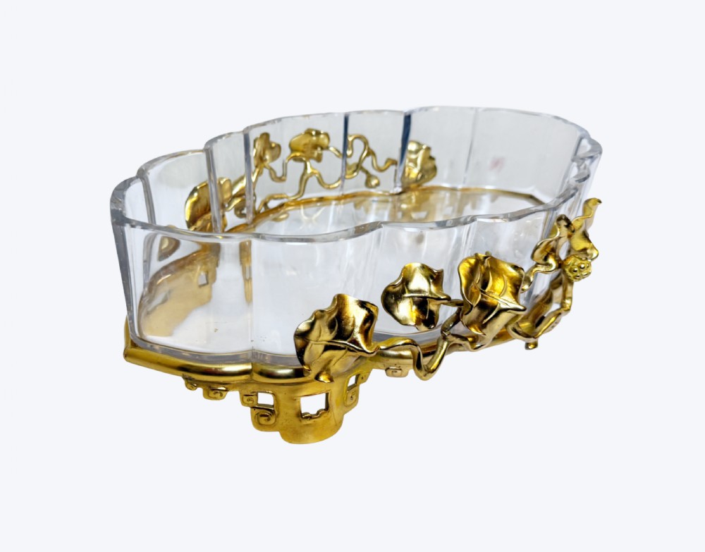 An oval crystal bowl set in an Art Nouveau gilt bronze frame adorned with sculpted leaves and organic vines. View VII