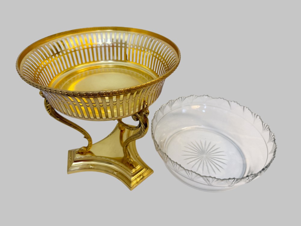 An antique French gilt bronze centrepiece with a pierced metal rim, tri-form base, and scalloped cut glass insert. View II