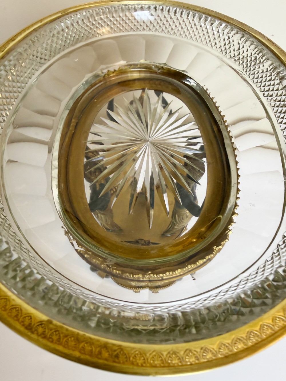 An early 19th-century cut-crystal bowl supported by four patinated bronze female caryatids with gilt drapery, set upon a circular gilt bronze base. View VI