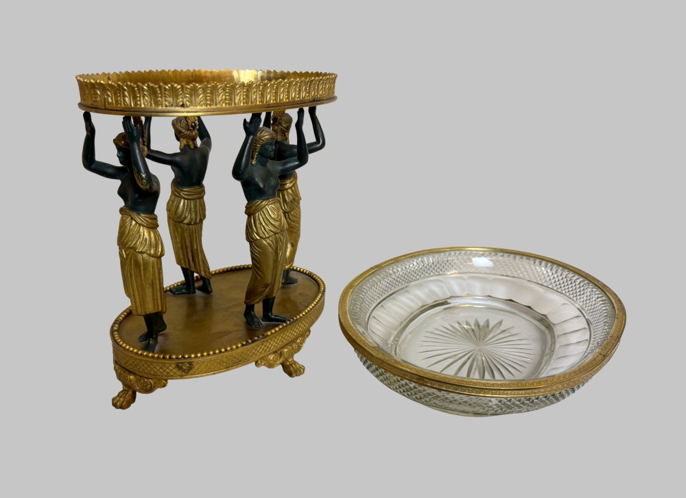An early 19th-century cut-crystal bowl supported by four patinated bronze female caryatids with gilt drapery, set upon a circular gilt bronze base. View VII