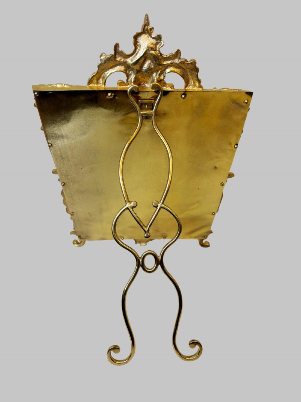 An ornate gold gilt bronze table mirror featuring Rococo scrollwork, floral garlands, and a carved crest motif. View VII