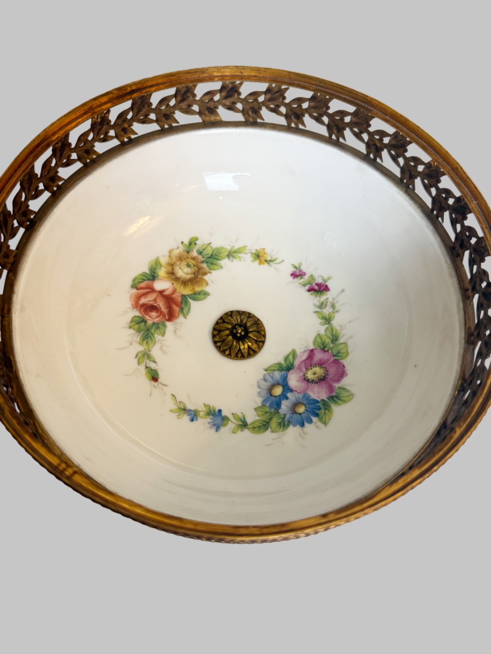 A late 19th-century French cobalt blue Limoges porcelain lidded dish decorated with hand-painted flowers, gilded scrollwork, a pierced brass gallery, and a pinecone finial. View III
