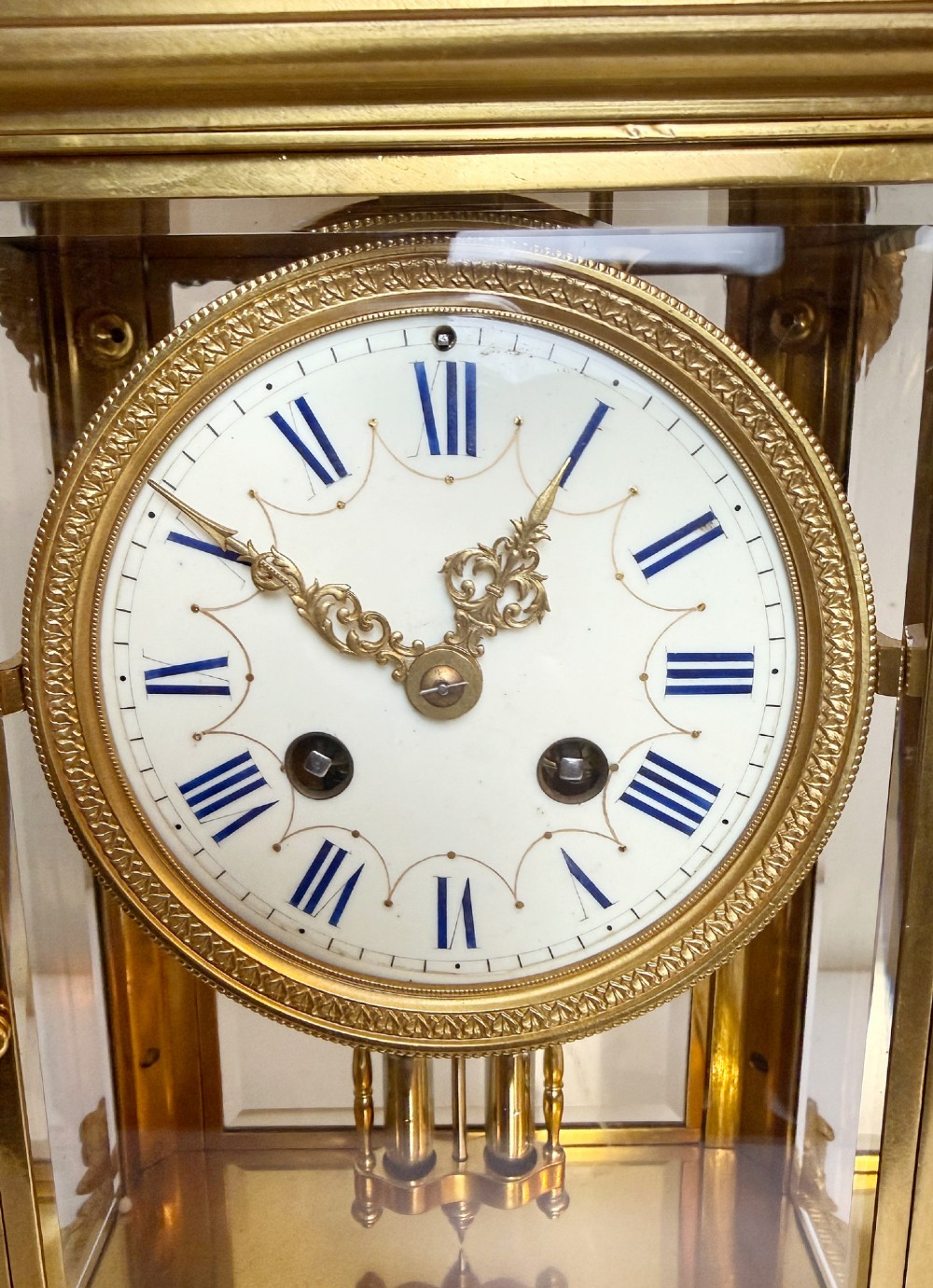 A late 19th-century French clock garniture featuring a gilt bronze mantel clock flanked by two matching champleve enamel side urns. View III