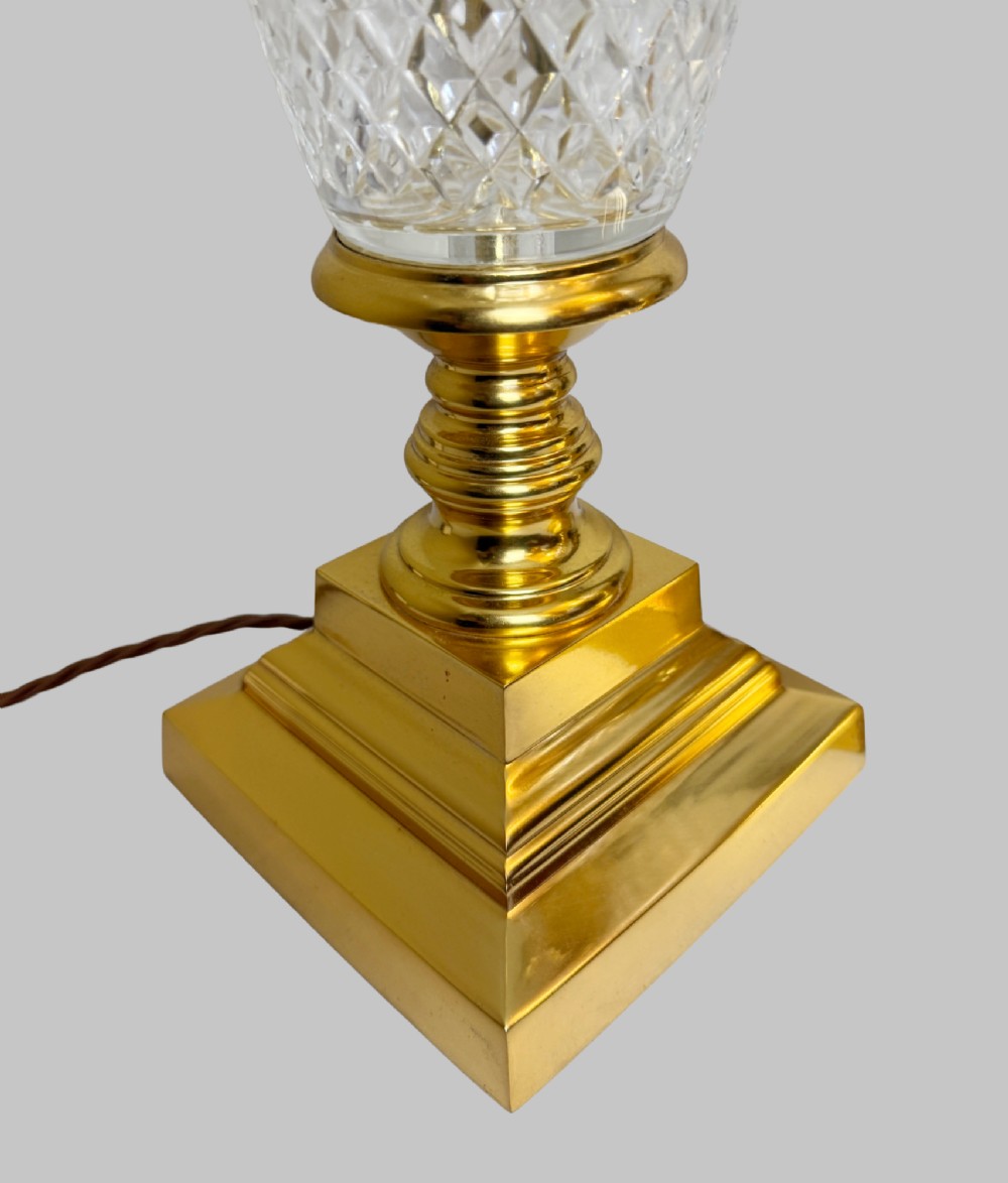 A pair of French gilt bronze and cut crystal table lamps designed in the shape of pineapples on square stepped bases. View IV
