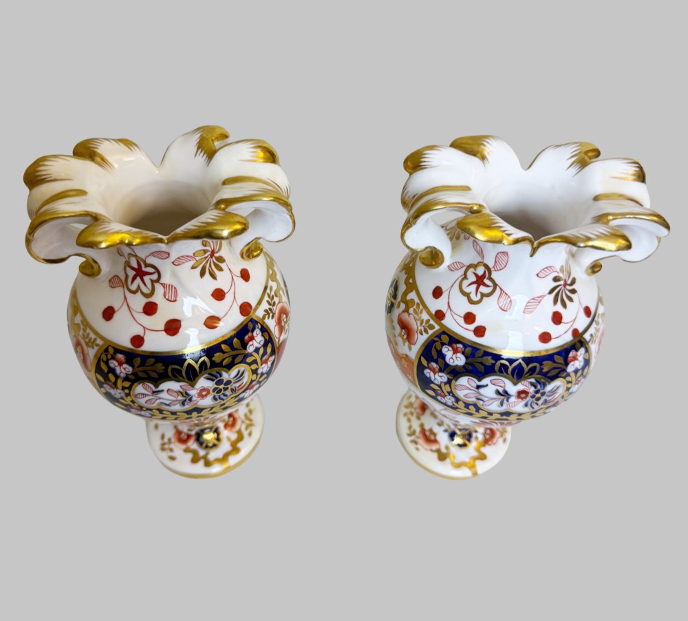 A pair of 19th-century Spode porcelain twin-handled vases decorated in a cobalt blue, iron red, and gold leaf Imari pattern. View III