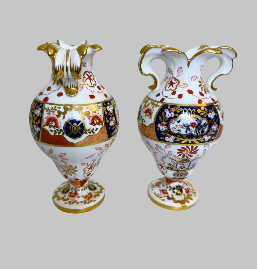A pair of 19th-century Spode porcelain twin-handled vases decorated in a cobalt blue, iron red, and gold leaf Imari pattern. View VII