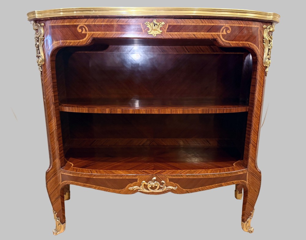 A late 19th-century French Louis XV style demilune open bookcase featuring marquetry wood veneer, gilt-bronze ormolu mounts, open shelving, and a glass vitrine top. View III