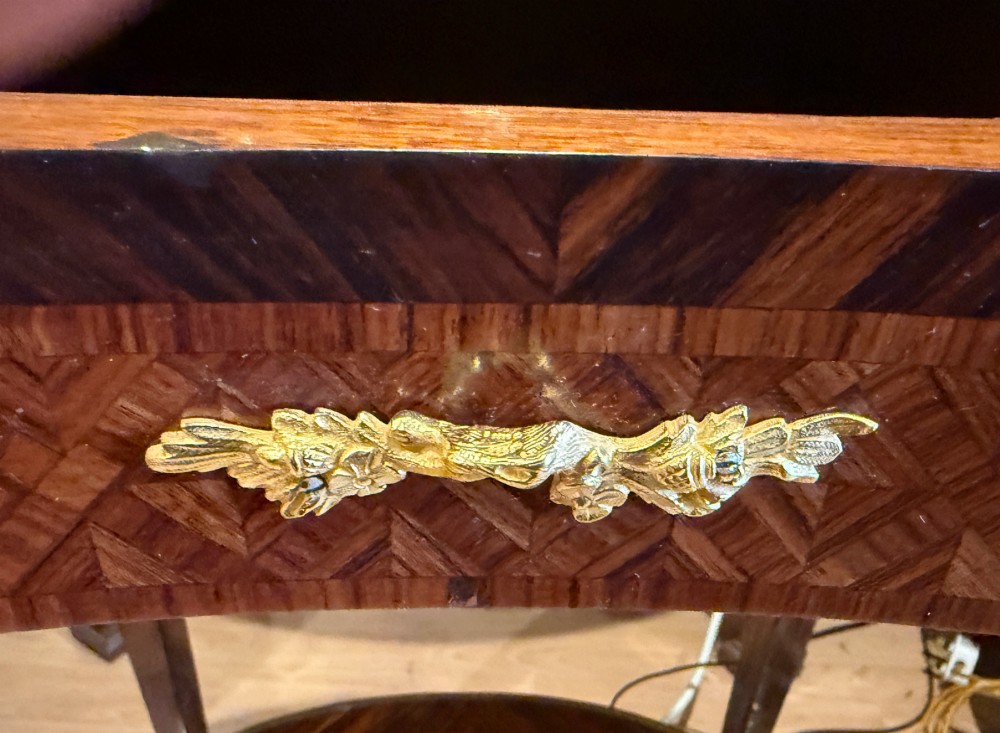 A nineteenth-century kidney-shaped side table with geometric parquetry inlay, a pierced brass gallery rim, and ormolu mounts on cabriole legs. View III