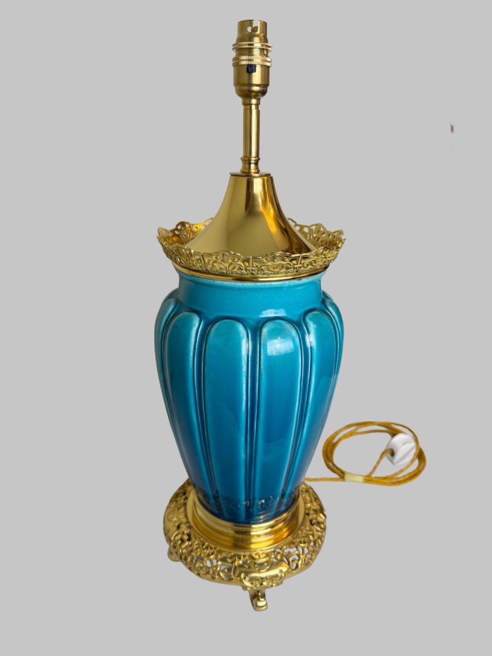 A 19th-century turquoise blue fluted porcelain table lamp with pierced gilt bronze base and collar trim. View II