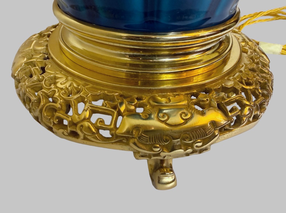 A 19th-century turquoise blue fluted porcelain table lamp with pierced gilt bronze base and collar trim. View IV
