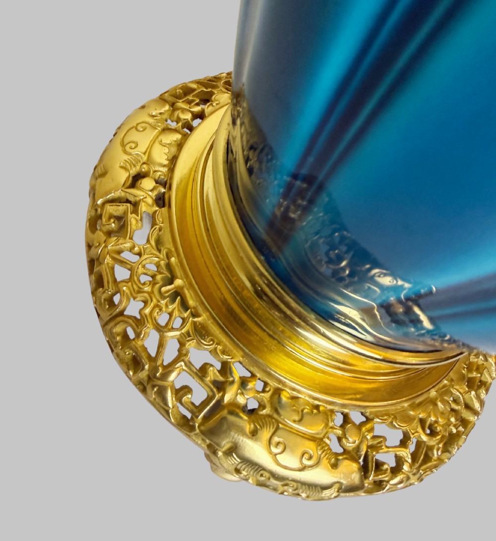 A 19th-century turquoise blue fluted porcelain table lamp with pierced gilt bronze base and collar trim. View V