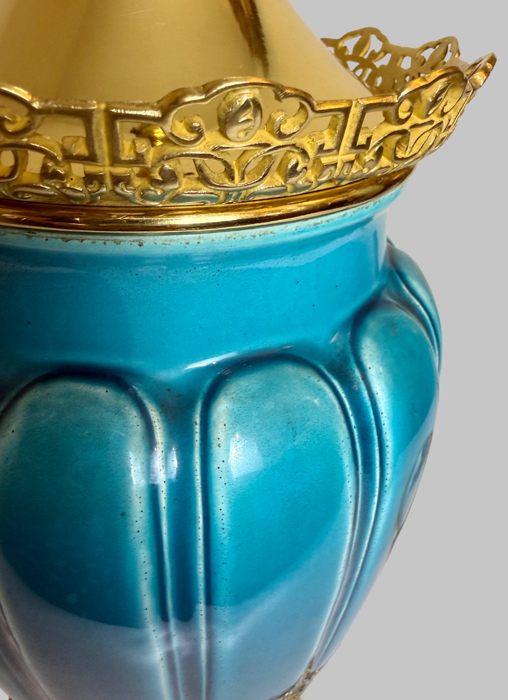 A 19th-century turquoise blue fluted porcelain table lamp with pierced gilt bronze base and collar trim. View VI