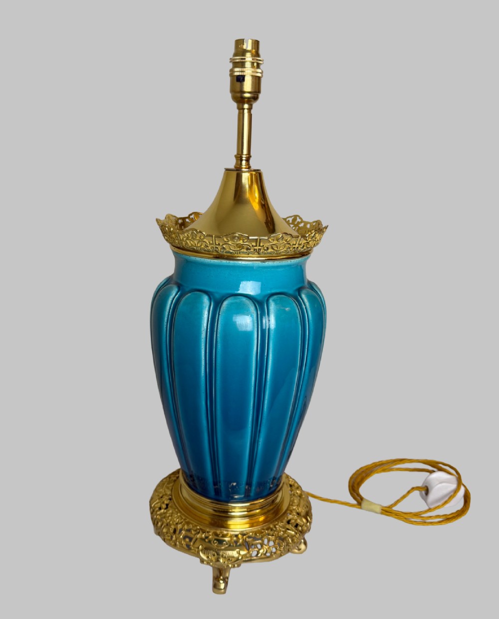 A 19th-century turquoise blue fluted porcelain table lamp with pierced gilt bronze base and collar trim. View VII