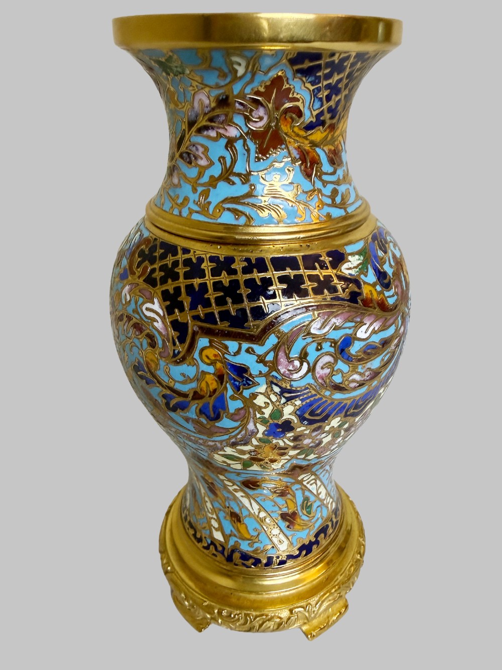 A pair of 19th-century French gilt bronze urn-shaped vases decorated with intricate turquoise and polychrome champleve enamel scrollwork. View V