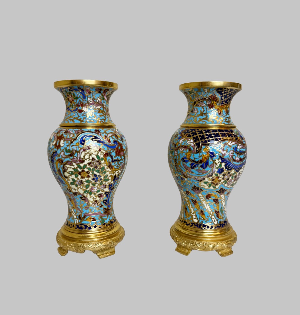 A pair of 19th-century French gilt bronze urn-shaped vases decorated with intricate turquoise and polychrome champleve enamel scrollwork. View VIII