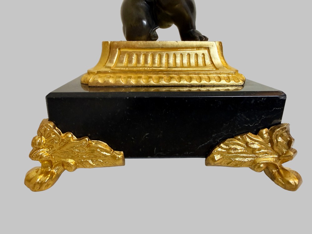 A pair of nineteenth-century gilt bronze and black marble tazzas featuring dark bronze winged cherub figures supporting fluted shallow bowls. View V