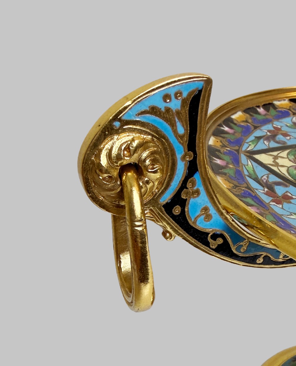 A 19th-century gilt bronze tazza featuring polychrome champleve enamel inlay across the shallow dish, pedestal foot, and side handles. View IV