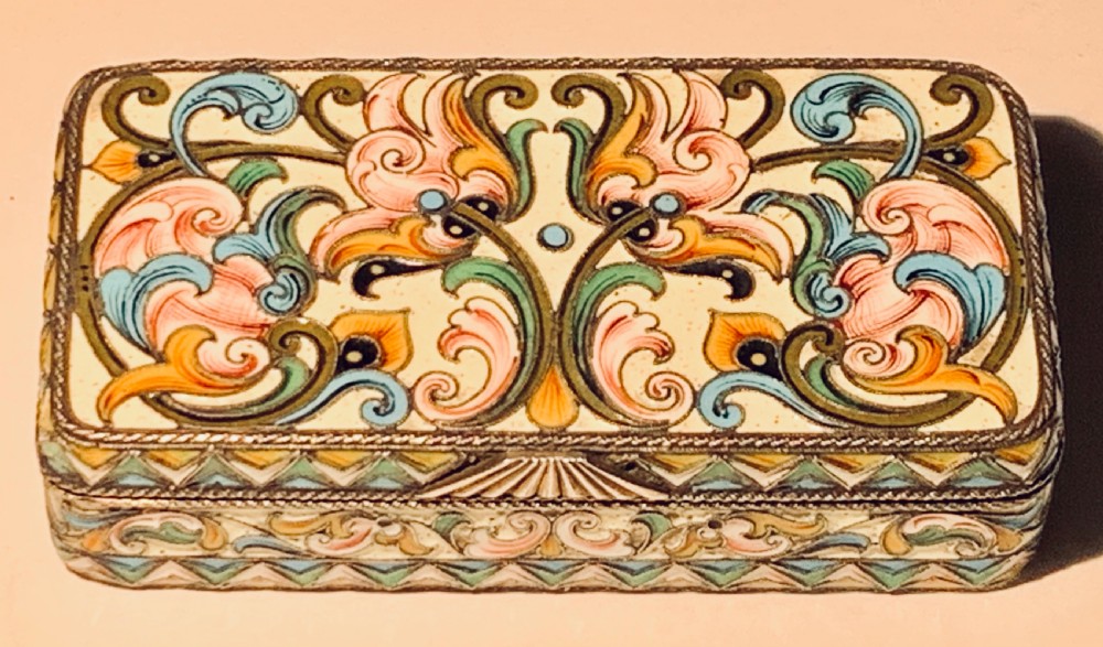 A rectangular Imperial Russian silver-gilt box decorated with floral multi-coloured shaded enamel over a cream background. View II