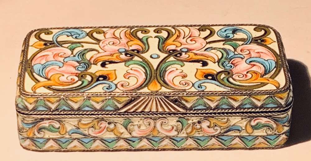 A rectangular Imperial Russian silver-gilt box decorated with floral multi-coloured shaded enamel over a cream background. View III