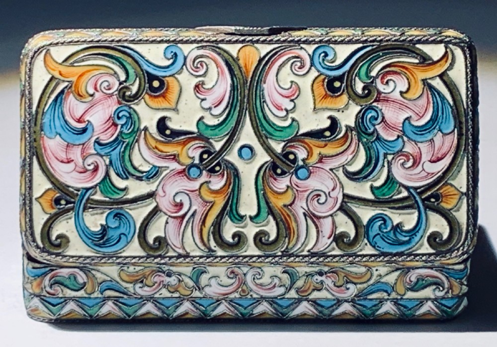 A rectangular Imperial Russian silver-gilt box decorated with floral multi-coloured shaded enamel over a cream background. View VI