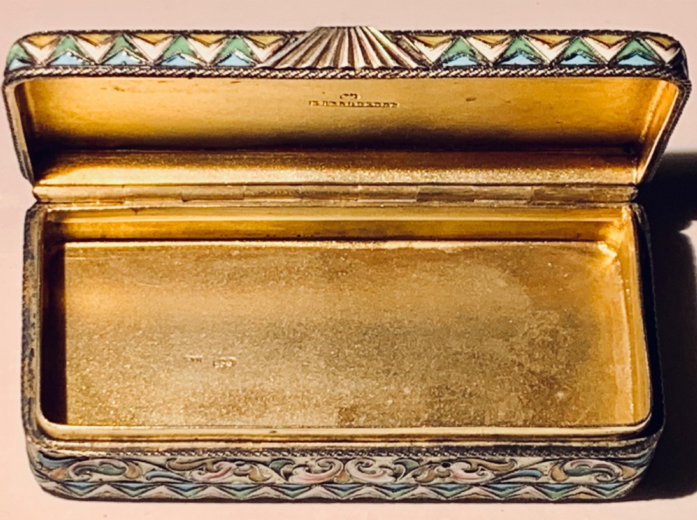 A rectangular Imperial Russian silver-gilt box decorated with floral multi-coloured shaded enamel over a cream background. View VII