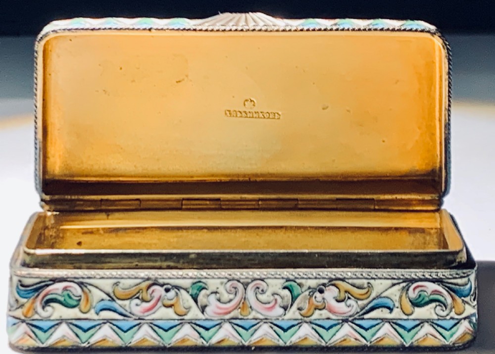 A rectangular Imperial Russian silver-gilt box decorated with floral multi-coloured shaded enamel over a cream background. View VIII