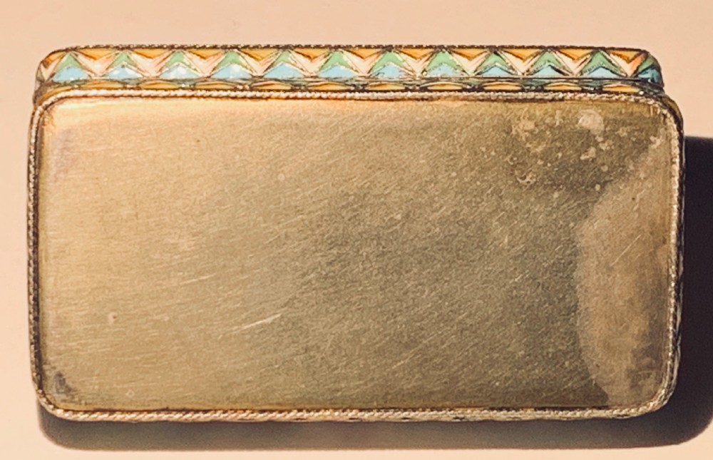 A rectangular Imperial Russian silver-gilt box decorated with floral multi-coloured shaded enamel over a cream background. View XII