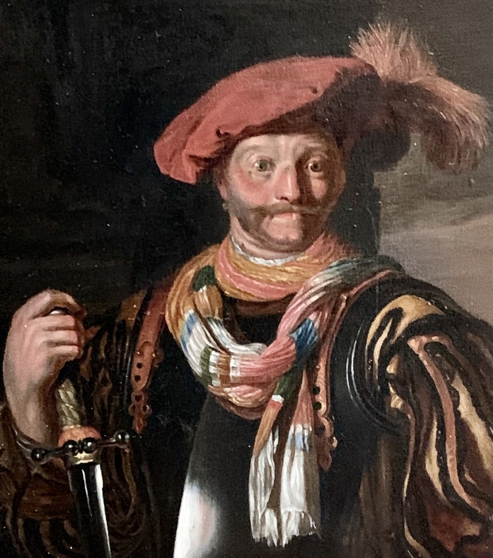 A framed half-length oil painting depicting a cavalier figure wearing a red feathered hat and a striped scarf while holding a sword hilt. View IV