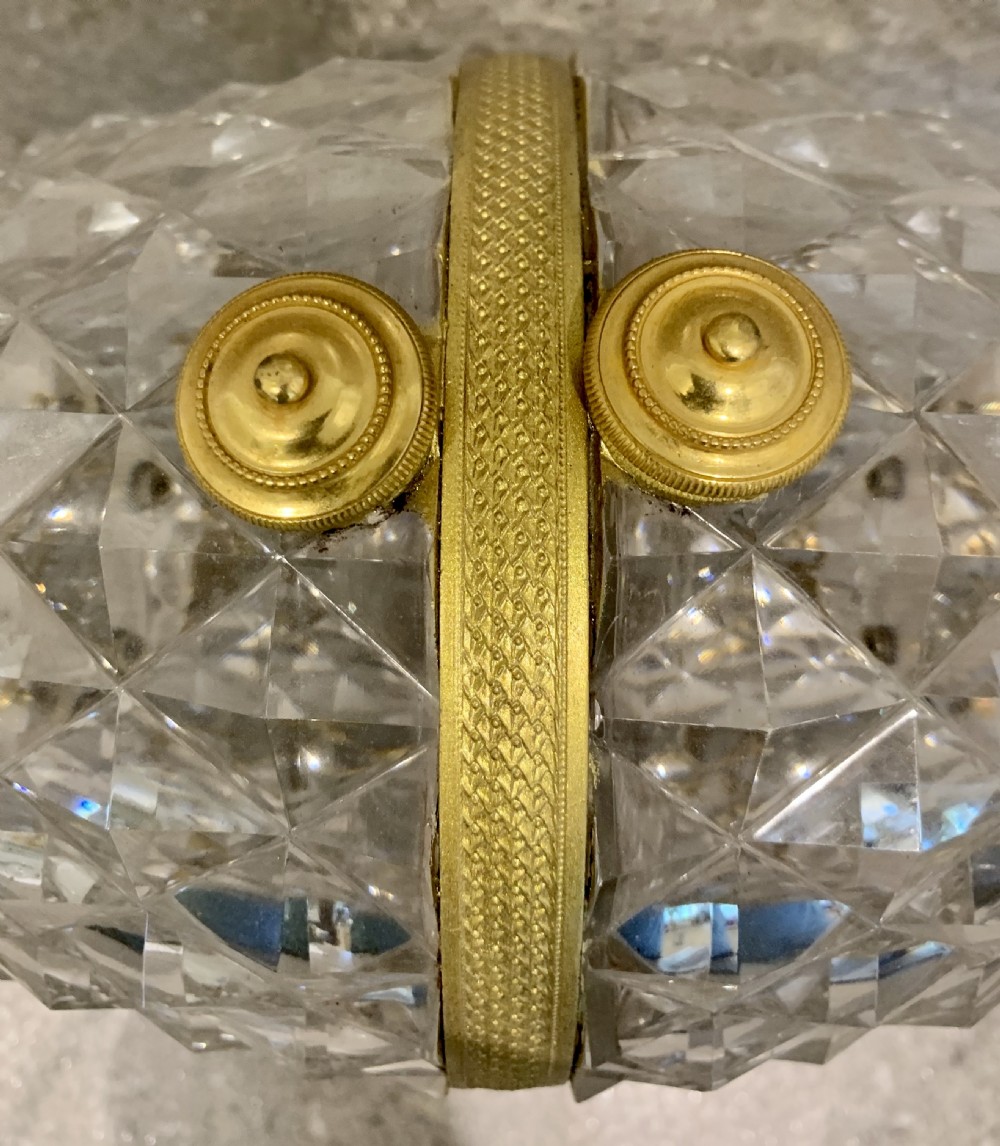 A French Charles X cut crystal glass barrel with gilt bronze swan-form mounts and an integrated tap set on a clear glass base. View XII