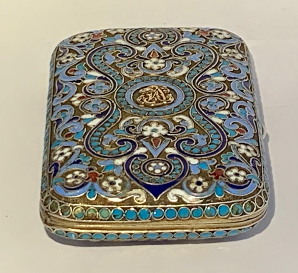 A rectangular silver-gilt box decorated with blue, white, and turquoise cloisonne enamel scroll motifs. View V