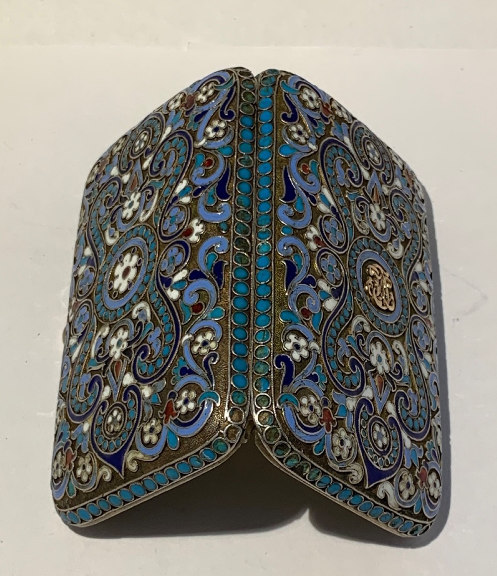 A rectangular silver-gilt box decorated with blue, white, and turquoise cloisonne enamel scroll motifs. View VIII