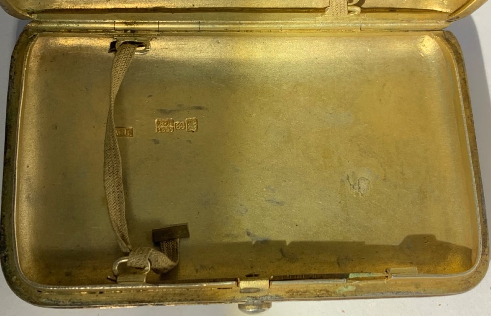 A rectangular silver-gilt box decorated with blue, white, and turquoise cloisonne enamel scroll motifs. View IX