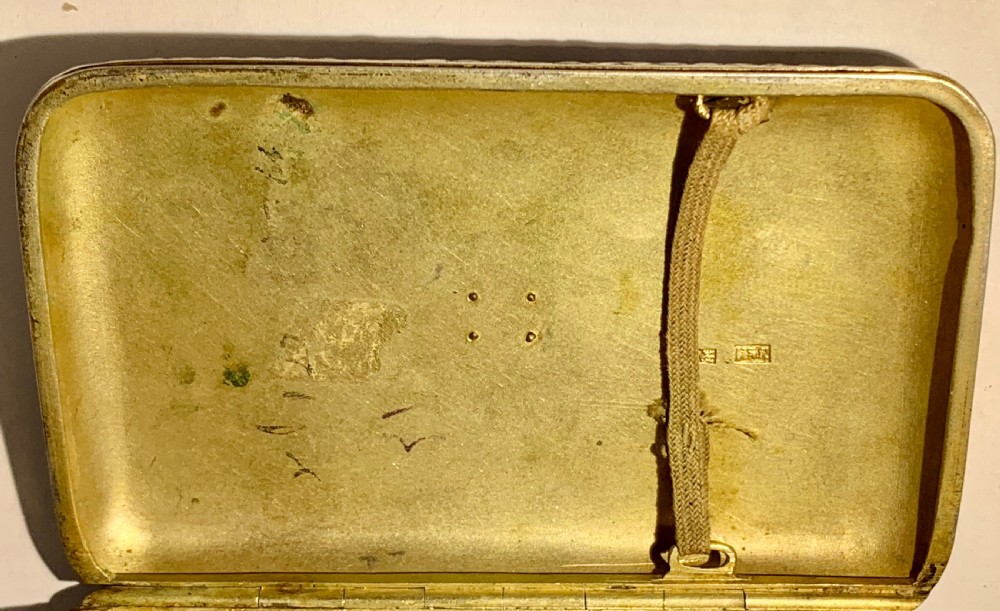 A rectangular silver-gilt box decorated with blue, white, and turquoise cloisonne enamel scroll motifs. View X