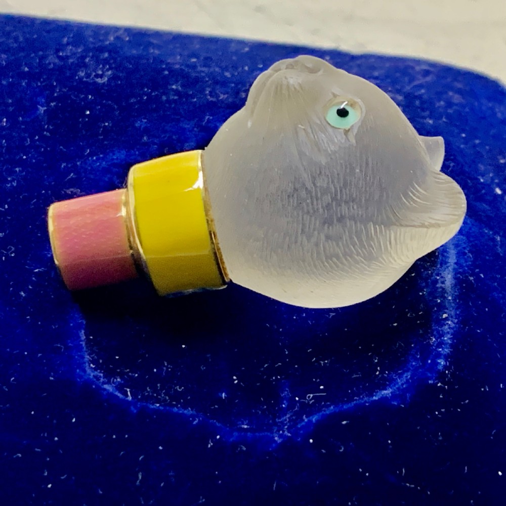 A carved frosted rock crystal cat head featuring green eyes, mounted atop an 18k gold collar with yellow and pink guilloche enamel. View III