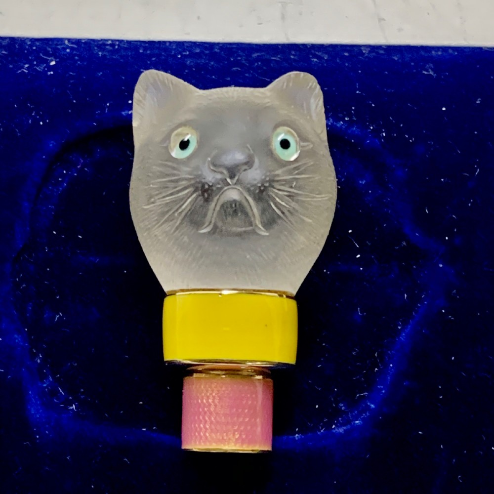 A carved frosted rock crystal cat head featuring green eyes, mounted atop an 18k gold collar with yellow and pink guilloche enamel. View IV
