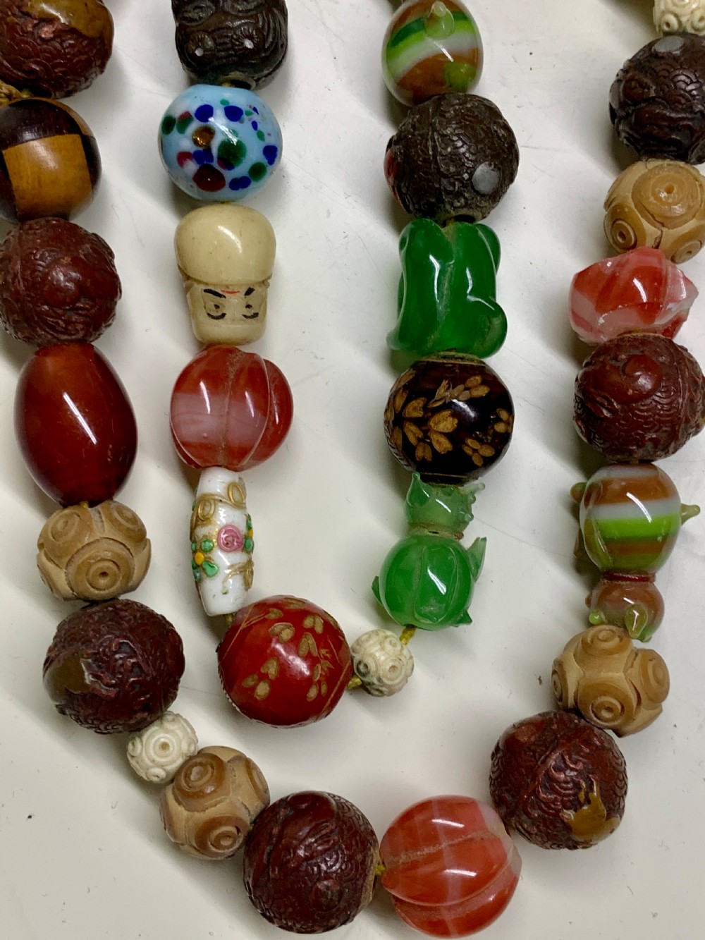 A  Necklace of 75 ojime beads, Japan, part Meiji period (1868-1912 View IX