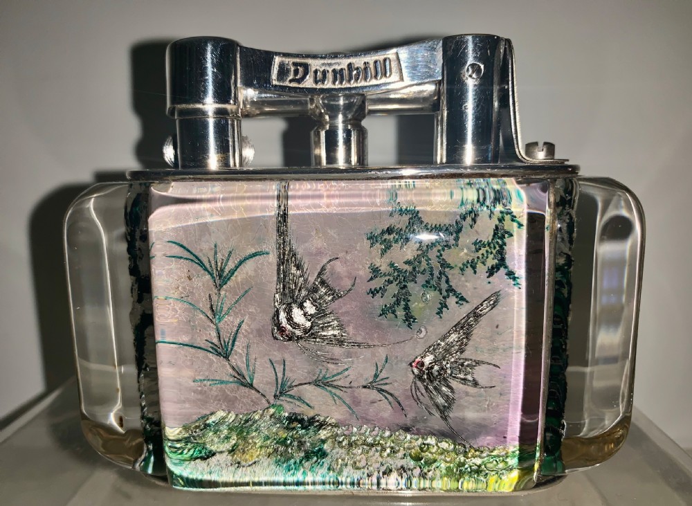 A mid-century Dunhill Aquarium table lighter featuring transparent acrylic panels reverse-carved with angelfish and aquatic plants beneath a silver-toned lift-arm mechanism. View III