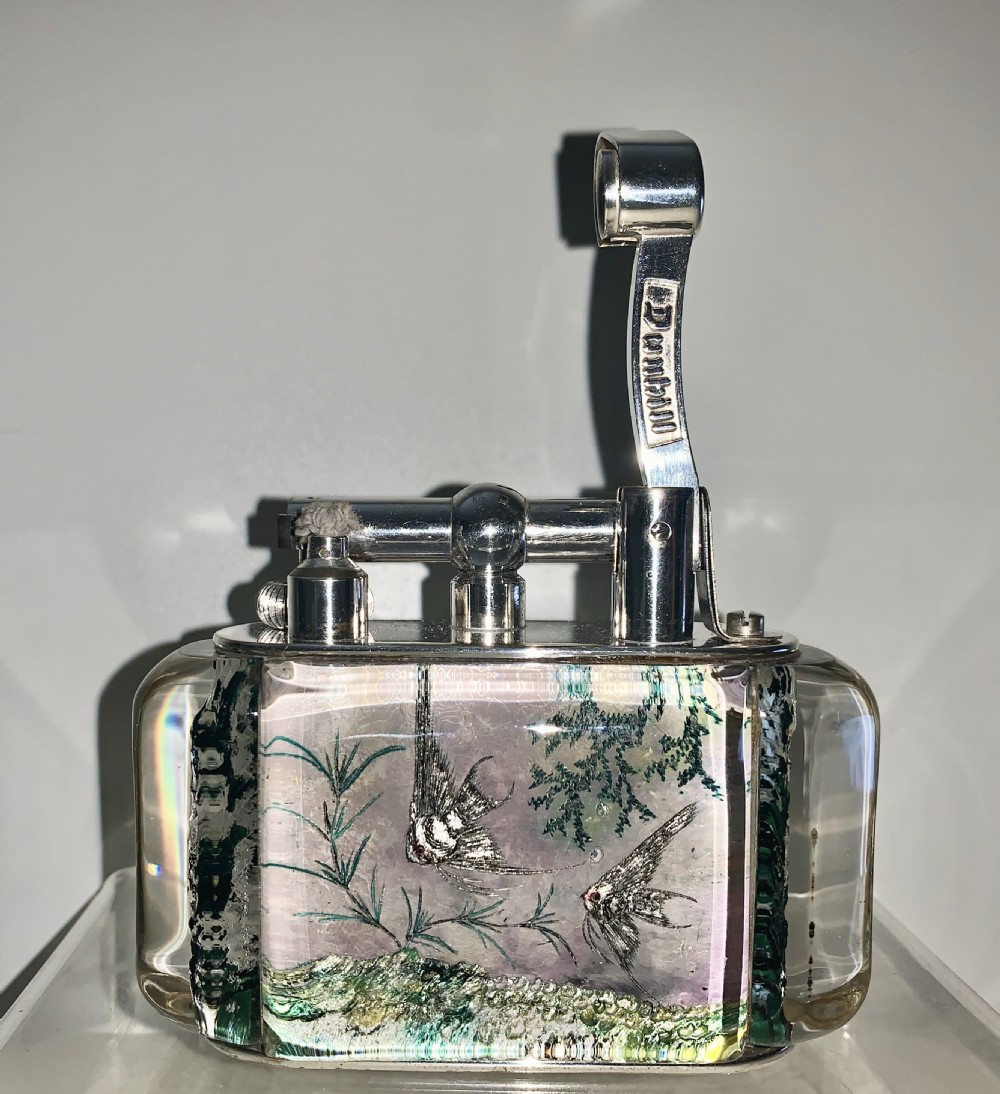 A mid-century Dunhill Aquarium table lighter featuring transparent acrylic panels reverse-carved with angelfish and aquatic plants beneath a silver-toned lift-arm mechanism. View IV