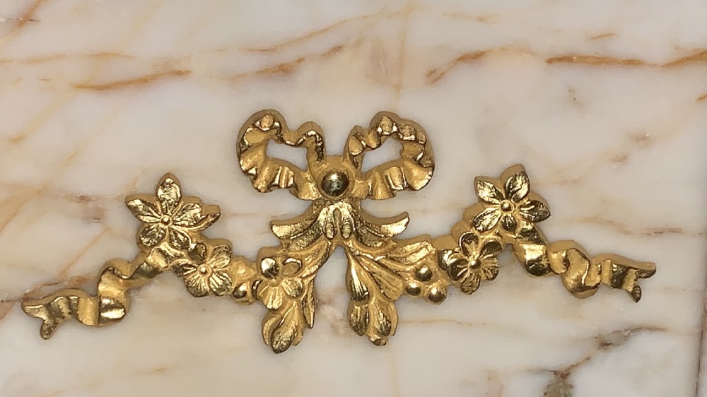 A tapered beige veined marble pedestal stand featuring ornate gilt bronze mounts and a square swivel top set upon a stepped base. View XV