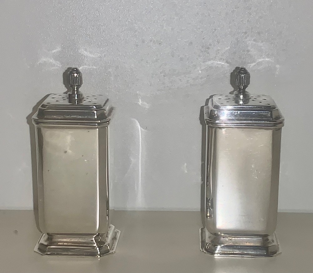 A six-piece Art Deco silver condiment set with matching spoons presented inside a fitted blue presentation box. View X