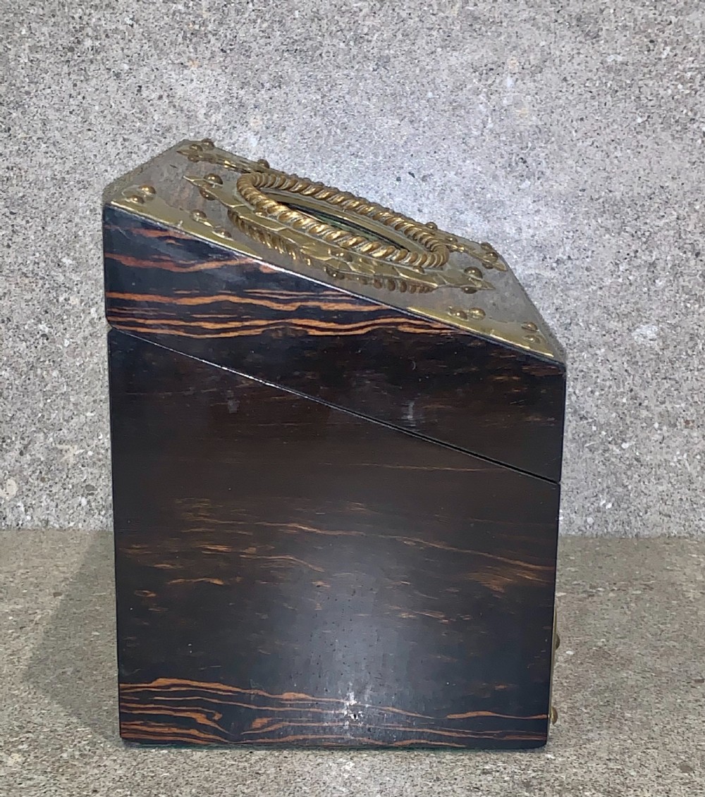 A dark striped coromandel wood stationery box with brass corner mounts, a central oval pietra dura floral plaque, and a brass keyhole escutcheon. View VI