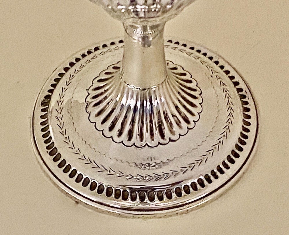 An 18th-century Georgian sterling silver goblet featuring bright-cut festoon engraving, lower bowl fluting, and a circular beaded pedestal foot. View III