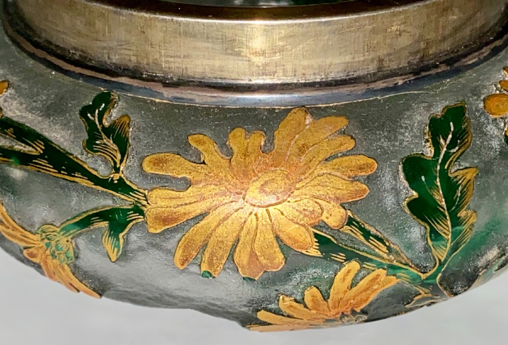 An Art Nouveau green cameo glass bowl featuring etched yellow floral enamelling and a chased silver cover. View III