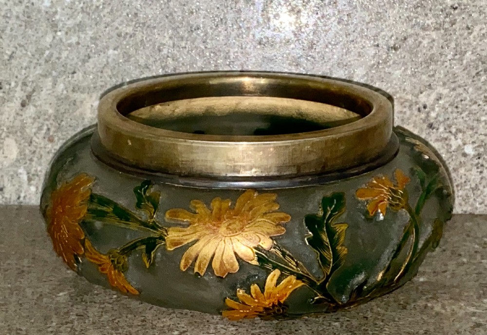 An Art Nouveau green cameo glass bowl featuring etched yellow floral enamelling and a chased silver cover. View VI