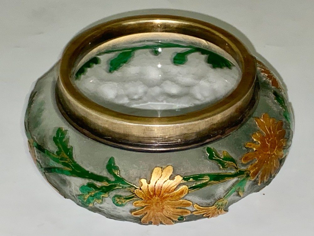 An Art Nouveau green cameo glass bowl featuring etched yellow floral enamelling and a chased silver cover. View VII