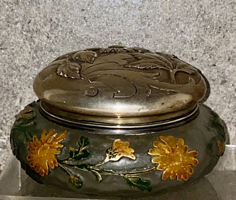 An Art Nouveau green cameo glass bowl featuring etched yellow floral enamelling and a chased silver cover. View II