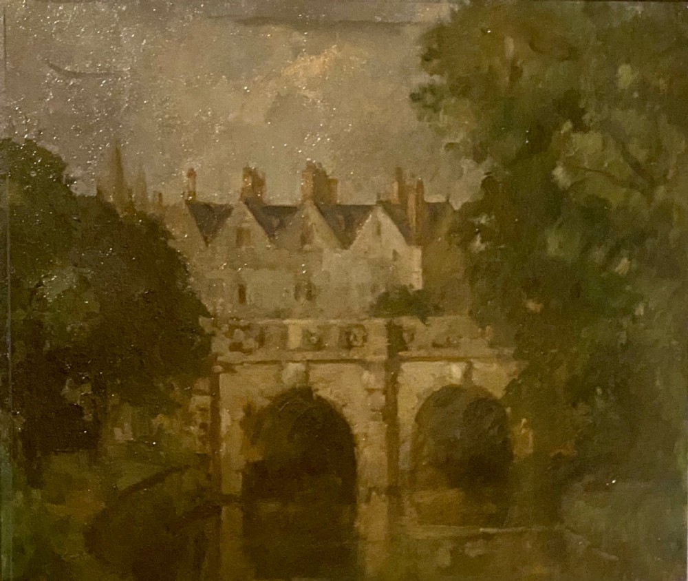 A framed oil painting on board depicting Magdalene Bridge in Oxford, featuring stone arches over water surrounded by trees and classical architecture. View VI