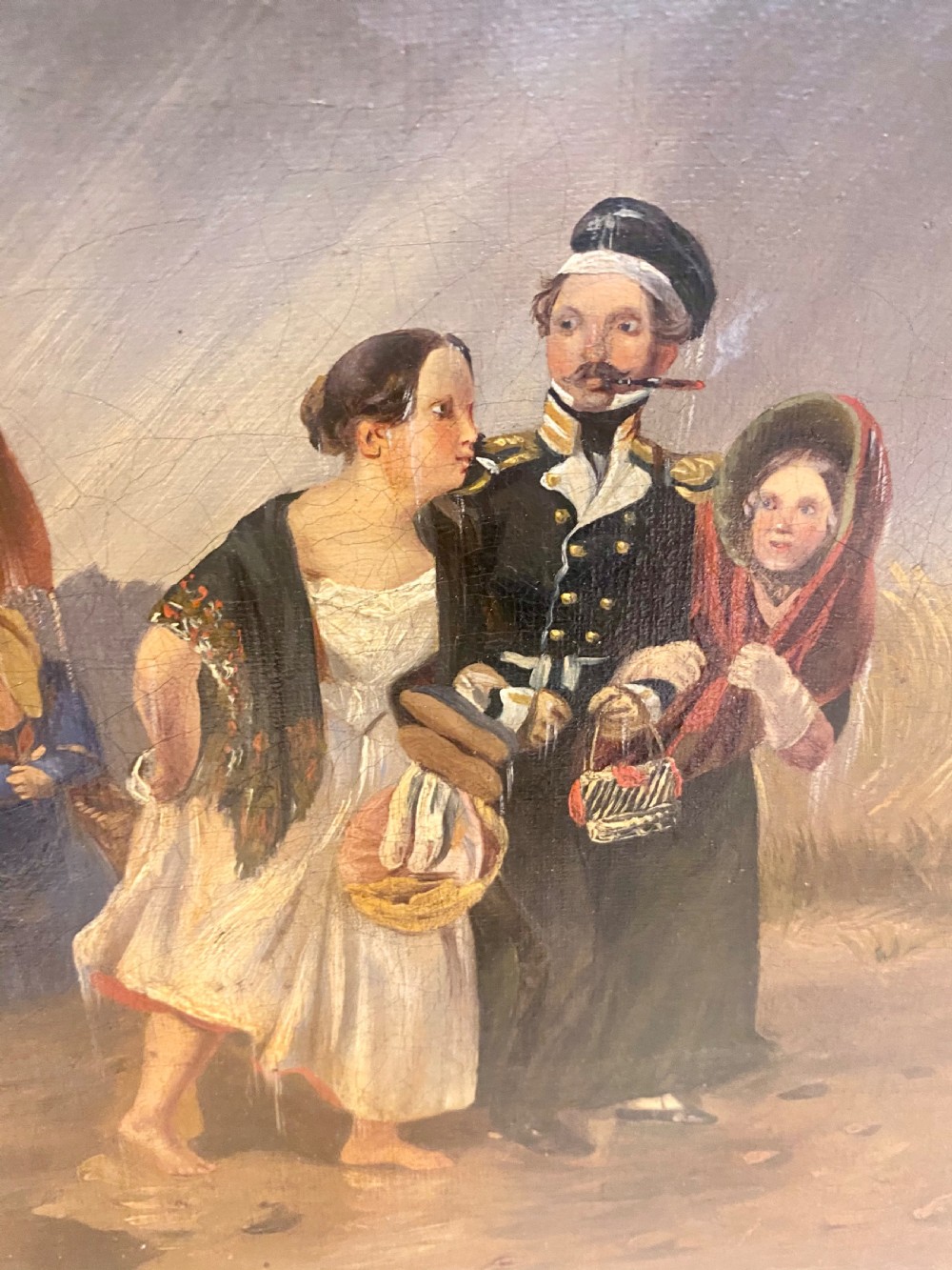 A 19th-century oil painting depicting several figures walking through rain under an umbrella, housed in a moulded gold frame. View VII
