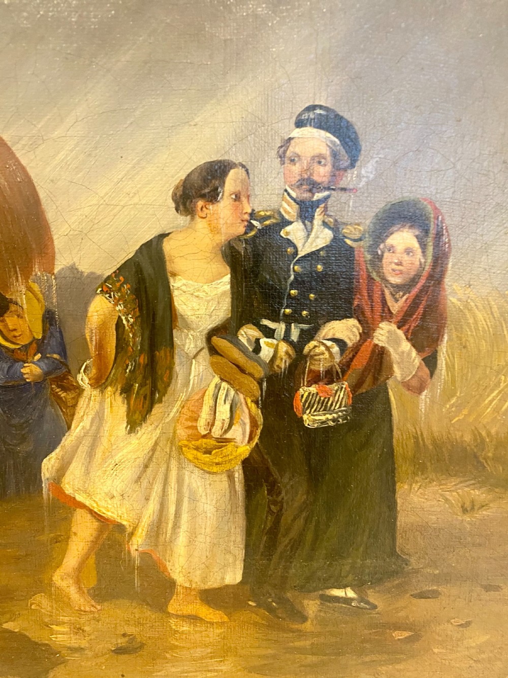 A 19th-century oil painting depicting several figures walking through rain under an umbrella, housed in a moulded gold frame. View XI